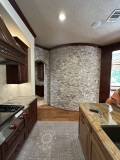 before-kitchen-stone-accent-wall-and-island