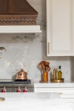 modern-kitchen-copper-range-hood-stone-slab-backsplash